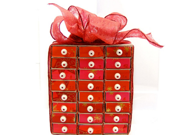 a red box with white dots and a red bow