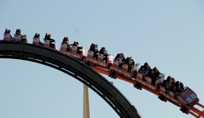 a roller coaster with people on it