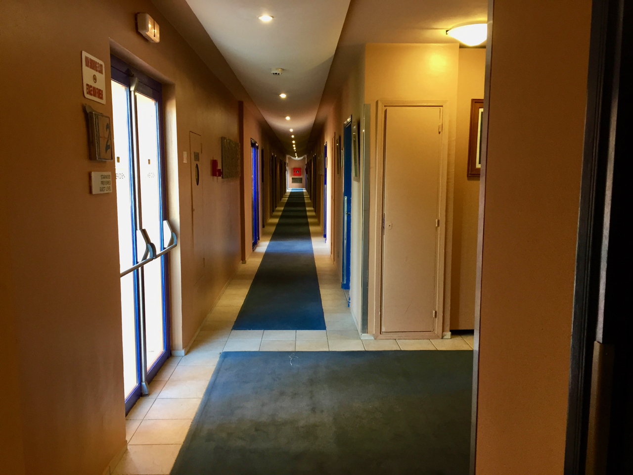 a hallway with doors and a door