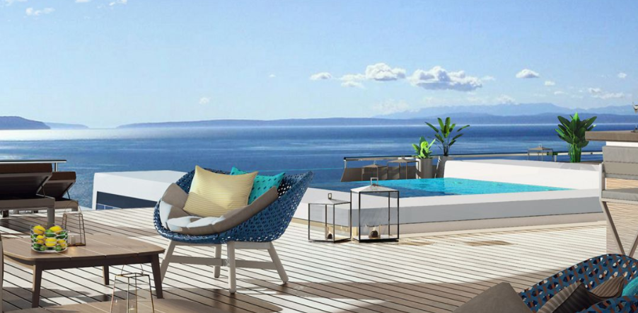 a chair on a deck overlooking a body of water