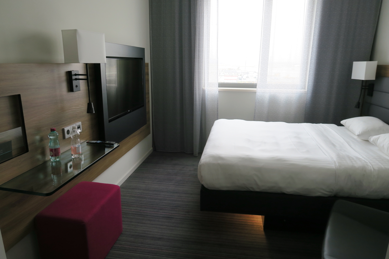 a bed with a tv in a room