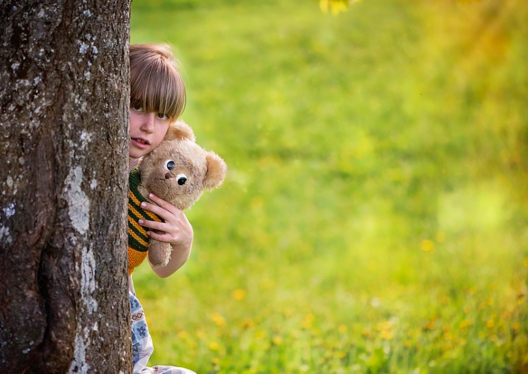 a girl holding a stuffed animal